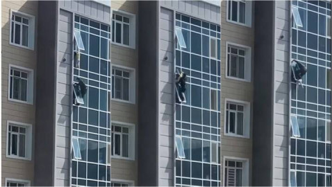 Héroe salva a niña de caer de un edificio 